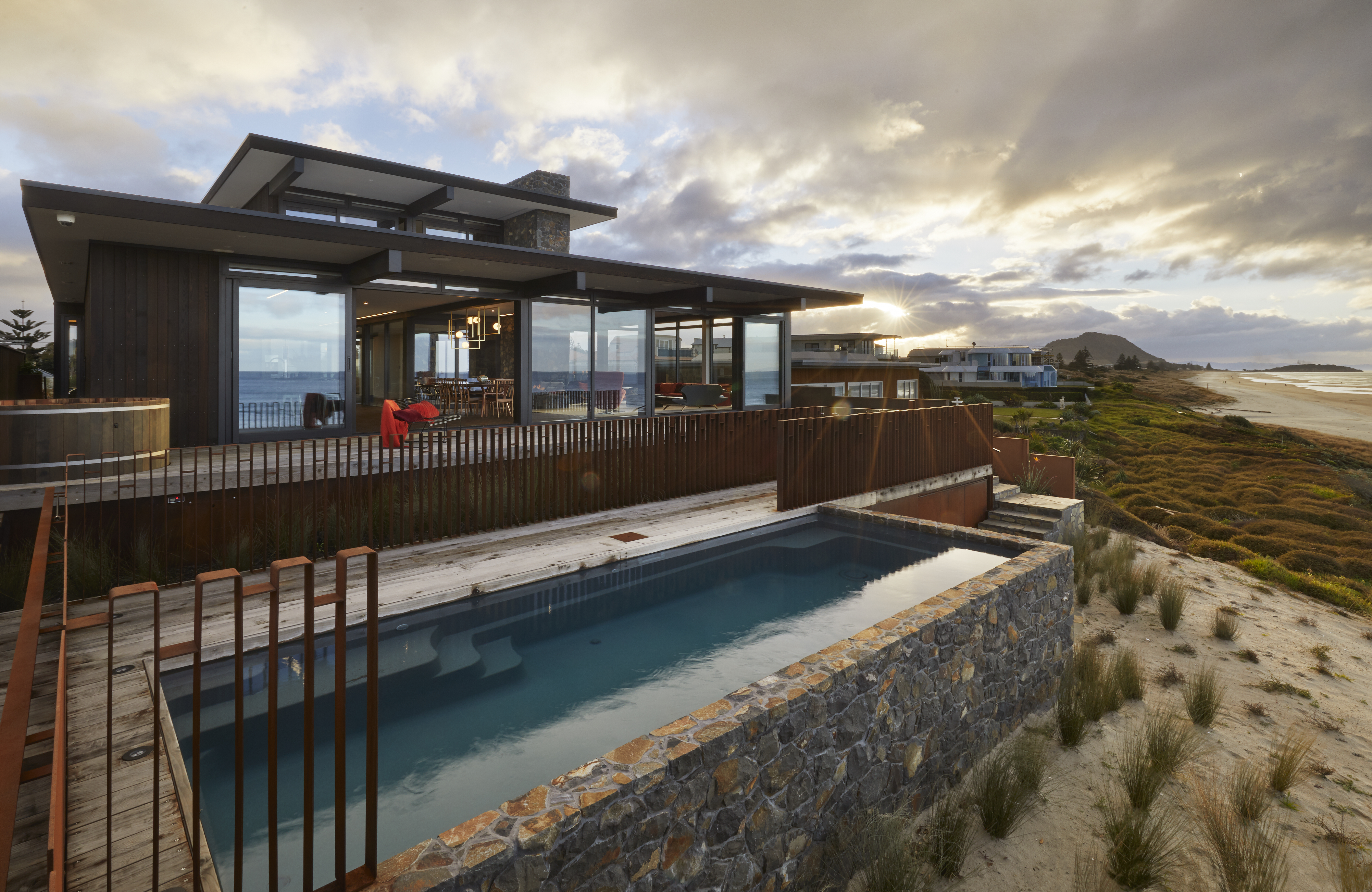 Contemporary beachfront architectural home with a pool
