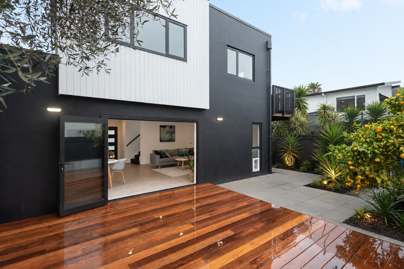 Renovated contemporary home opening onto a timber outdoor living area